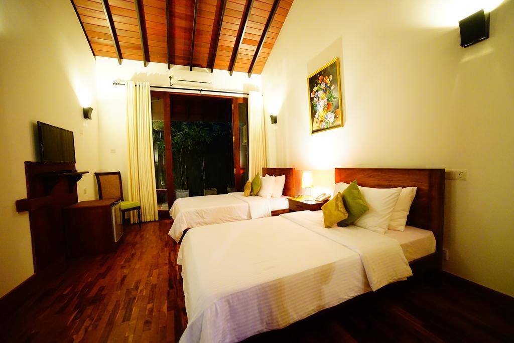 Lespri Grand Hotel Negombo Quarto foto